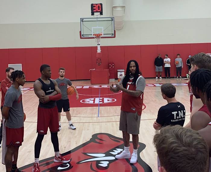 Waka Flocka Flame speaks to the Arkansas Razorbacks men's basketball team after practice. 